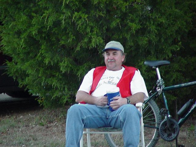 Dick Nenow watching the judging of the cooking contest.JPG